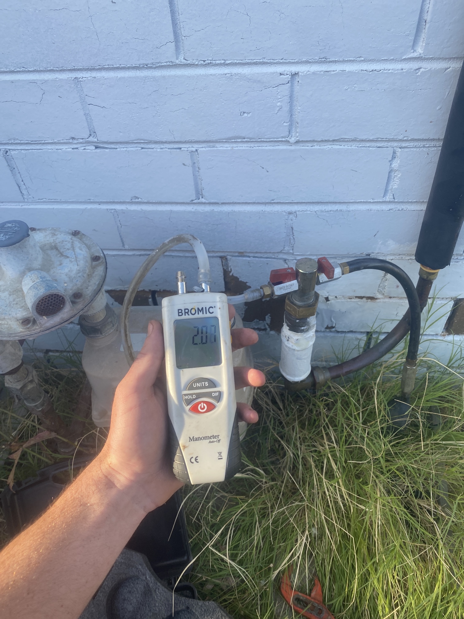 Gas leak detection equipment testing a gas connection